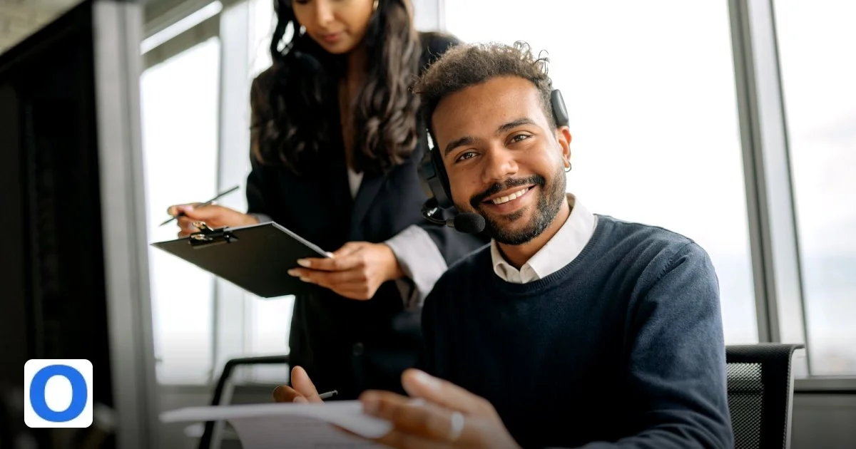 Building a 24/7 Support Operation Without Burning Out Your Team - friendly call center agent wearing a headset, talking